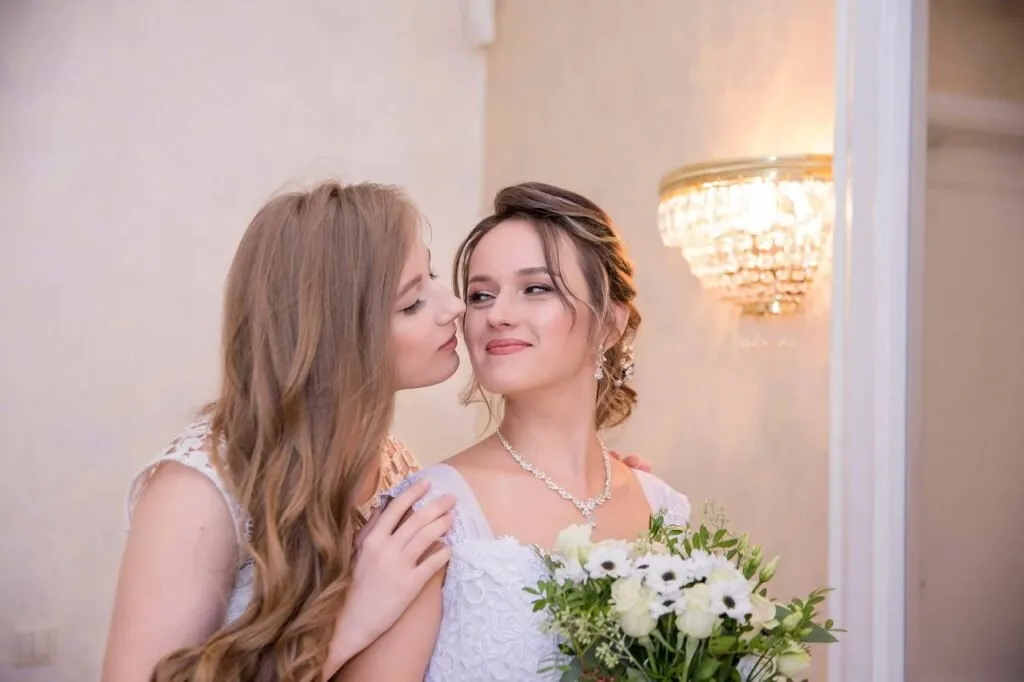 Soft romantic bridal makeup and elegant updo hairstyle by ABC Face in Chicago