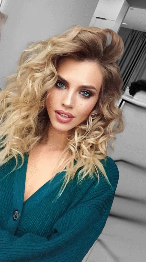 Glam waves event makeup with radiant glow and voluminous curls in Chicago