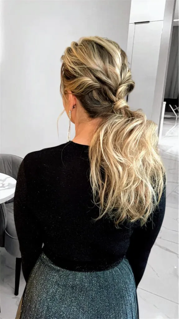 Textured low ponytail with braids and soft volume for weddings and events in Chicago