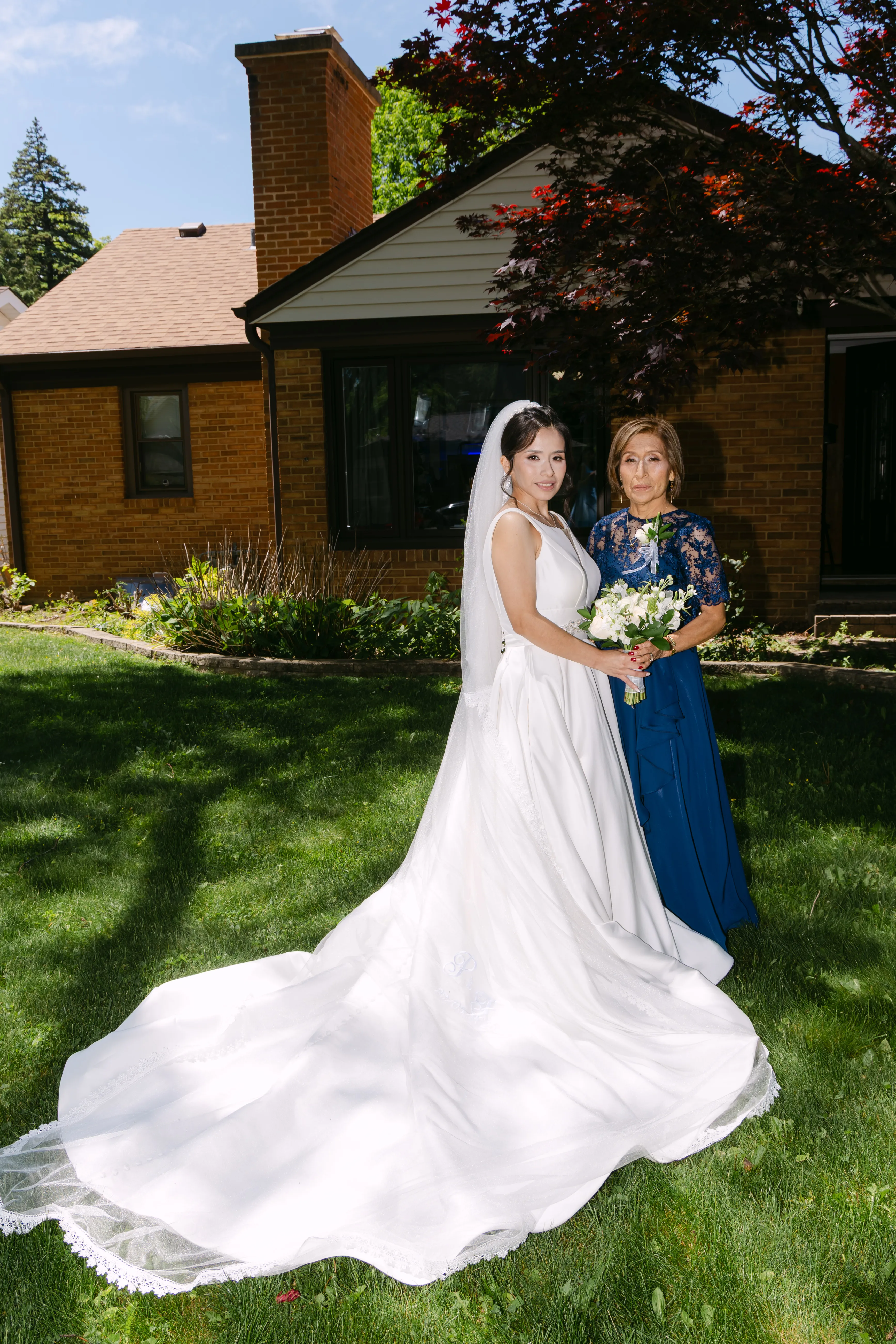 Bride with her mother on the wedding day after makeup and hair styling