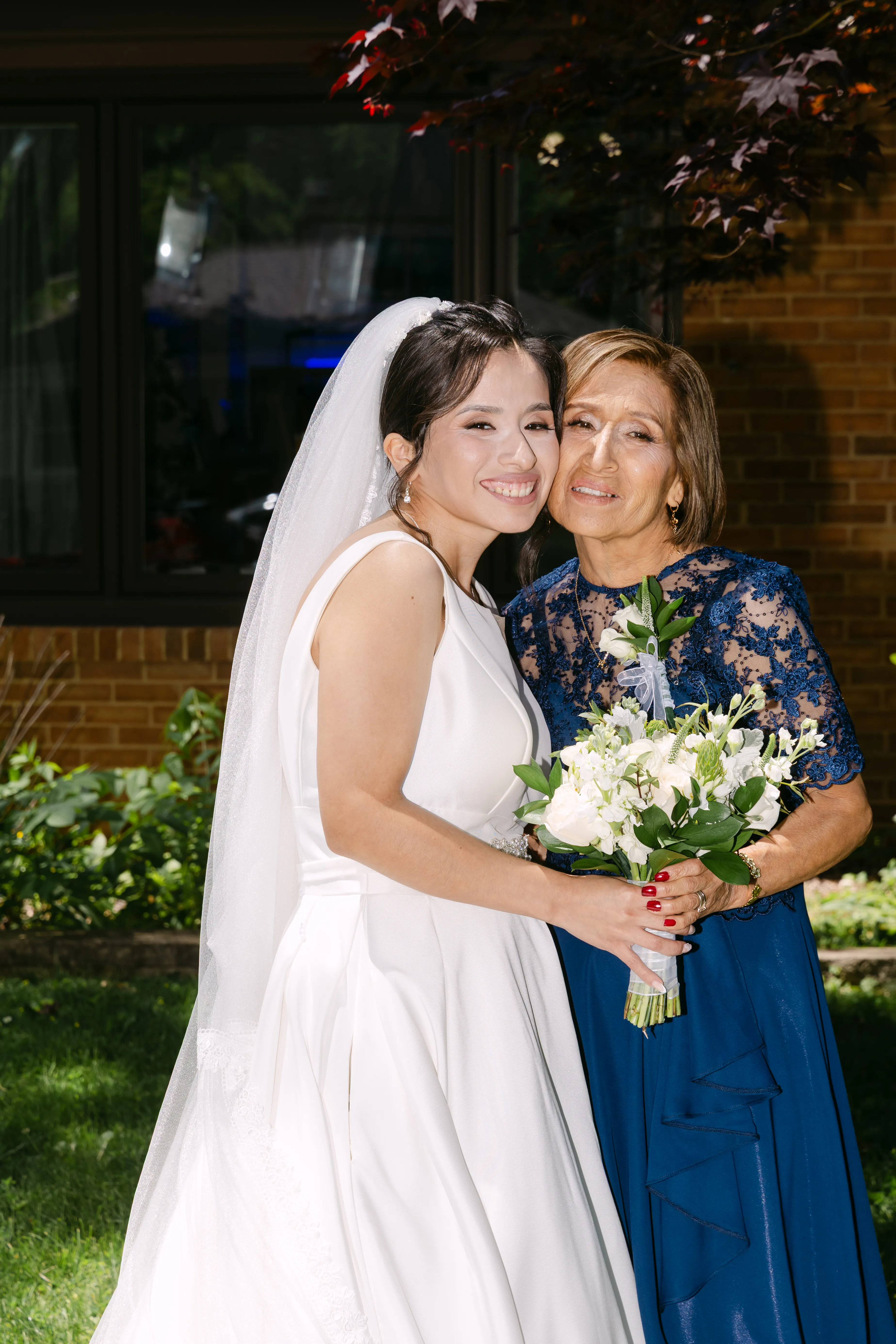 Bride and mother with wedding bouquet