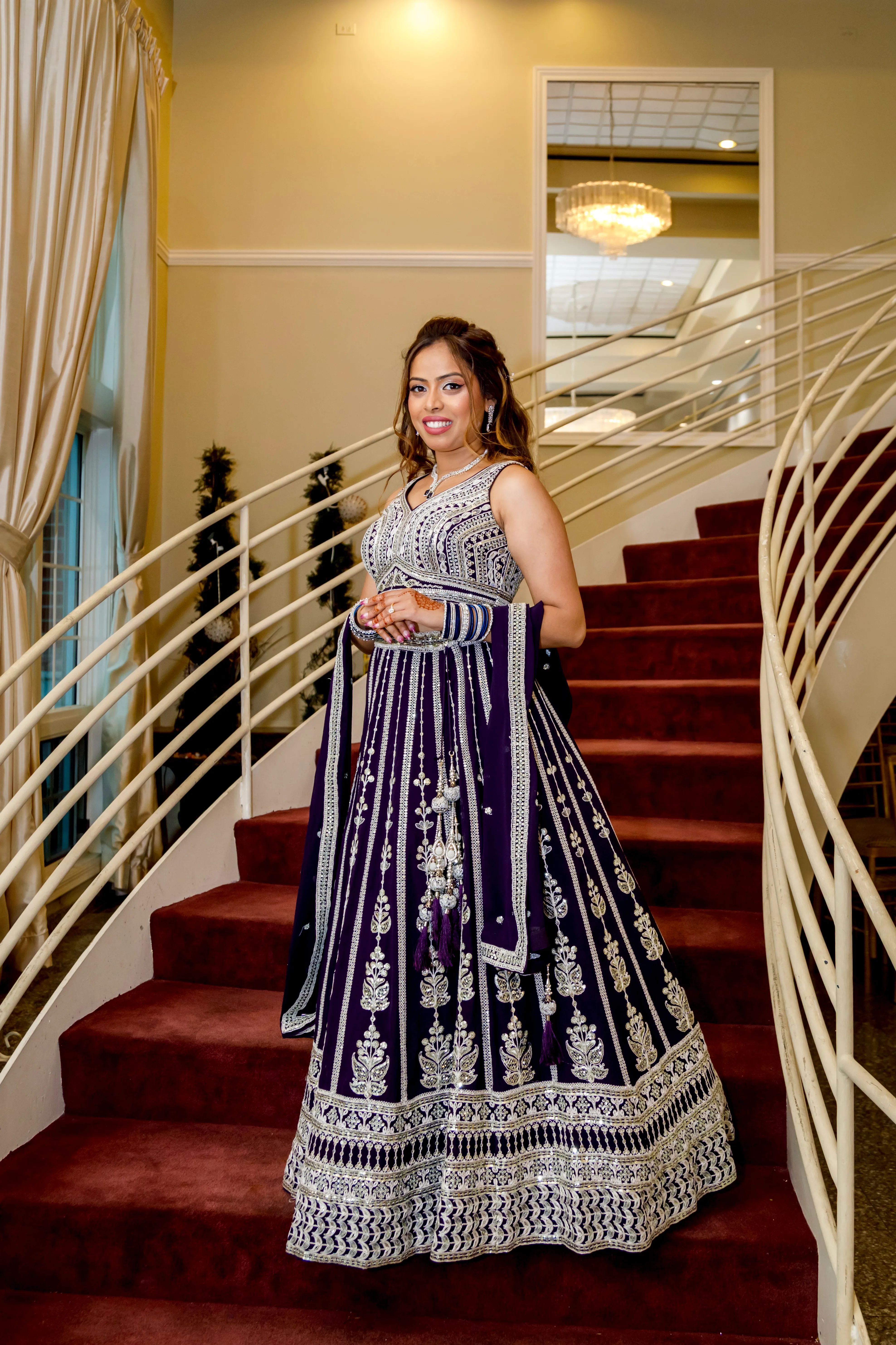 Bride with soft glam makeup and romantic waves in a formal celebration look