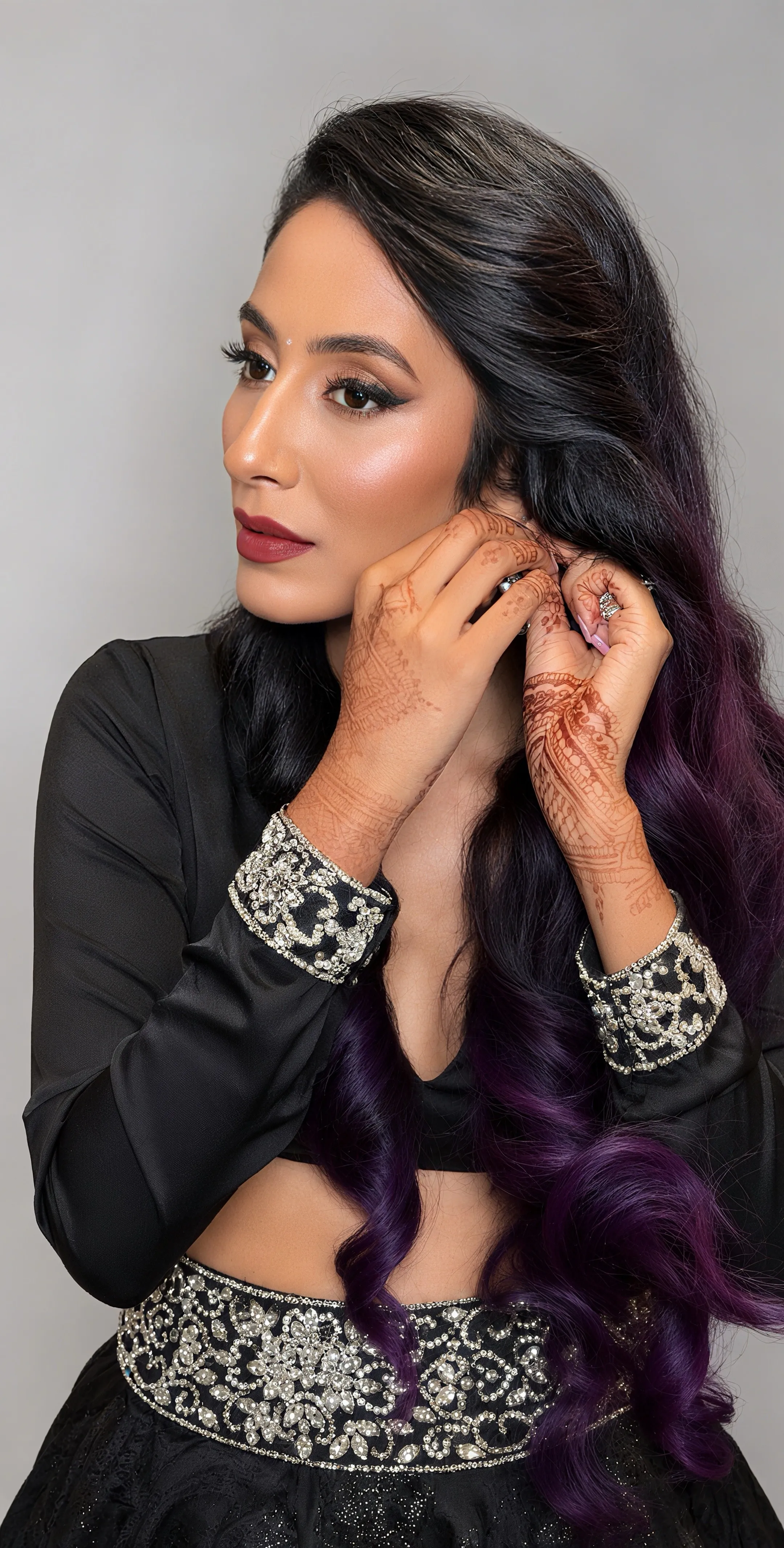 Soft glam event makeup with softly defined eyes and a berry-rose lip