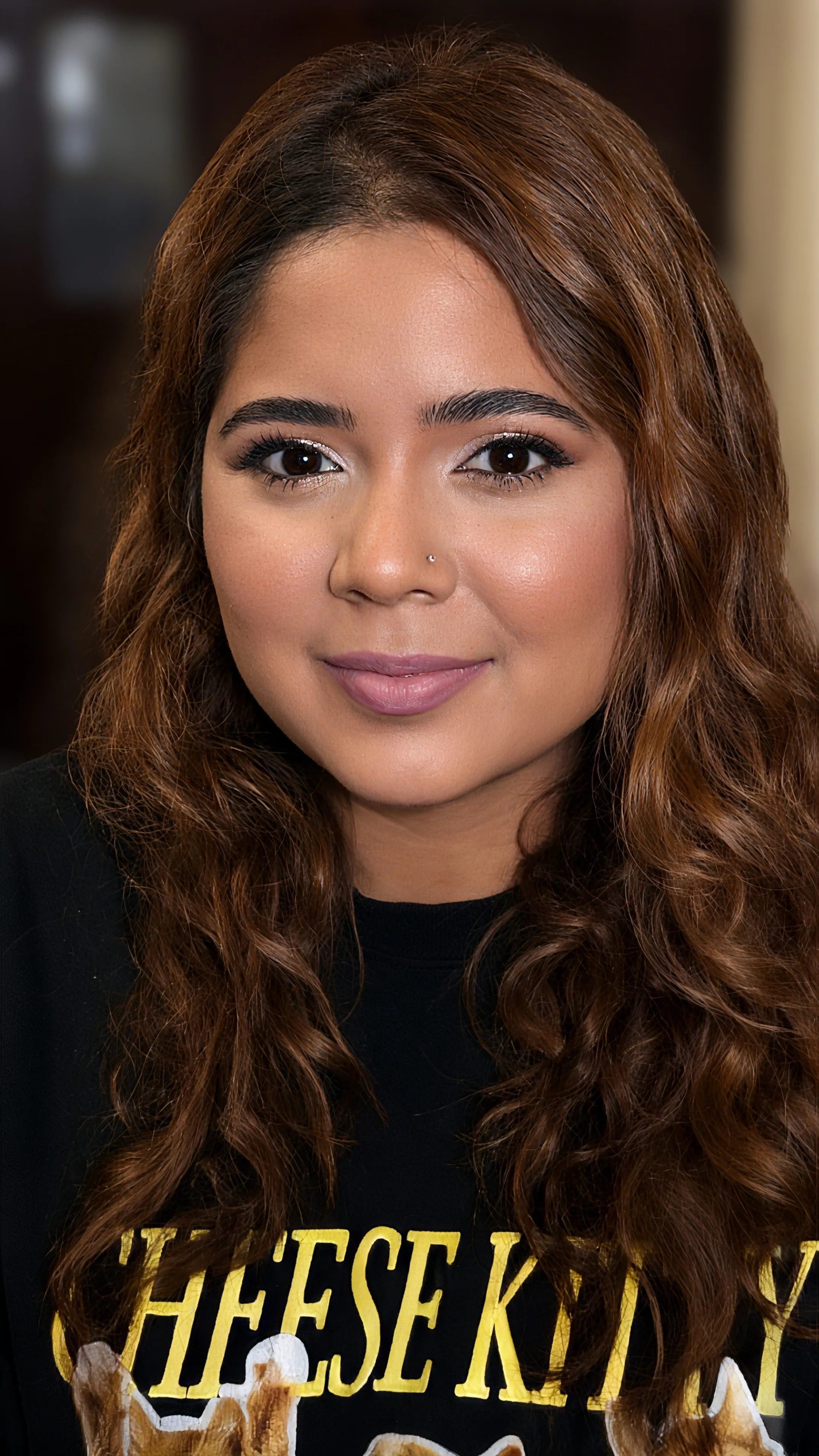 Soft glam event makeup with softly blended neutral eyes, lifted lashes, and rose-nude lips
